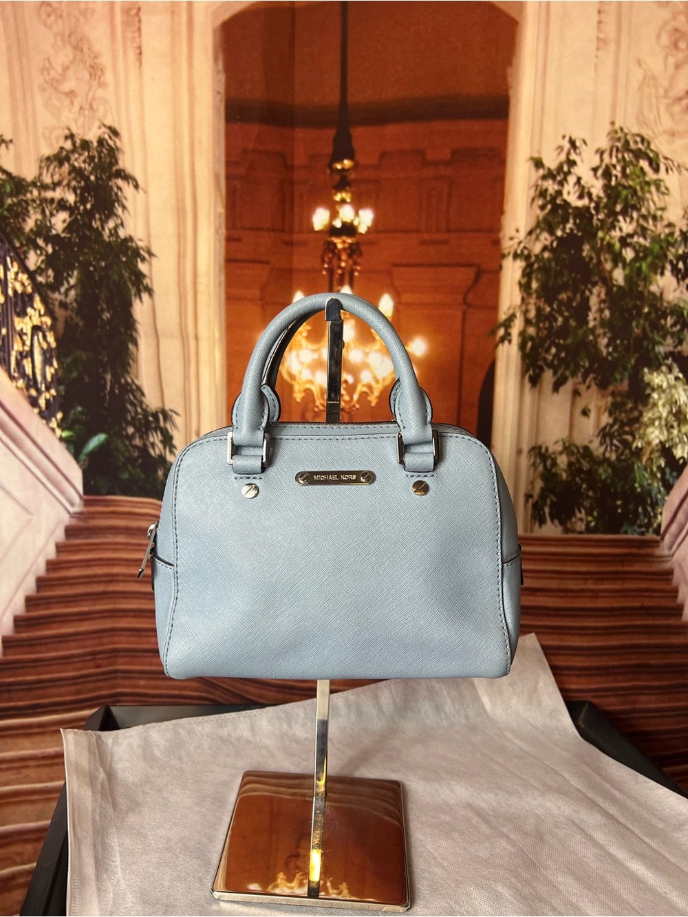 Michael Kors Savannah small satchel is crafted from baby blue saffiano leather